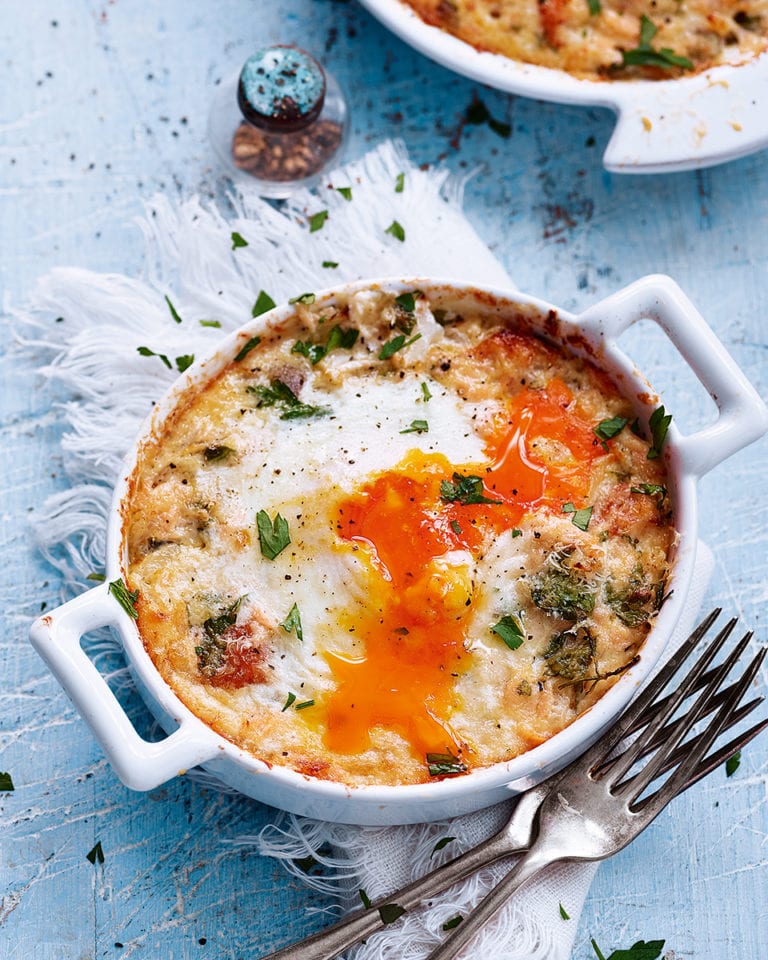 Baked eggs with hot-smoked salmon and herbs recipe