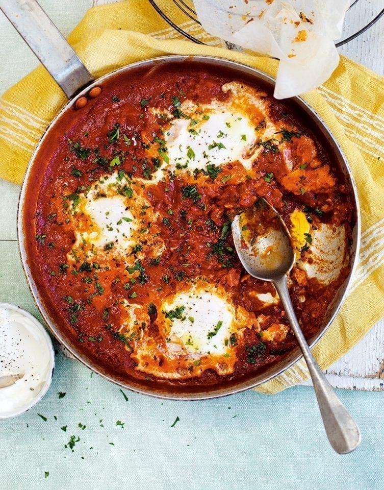 Tomato-baked eggs with soured cream recipe | delicious. magazine