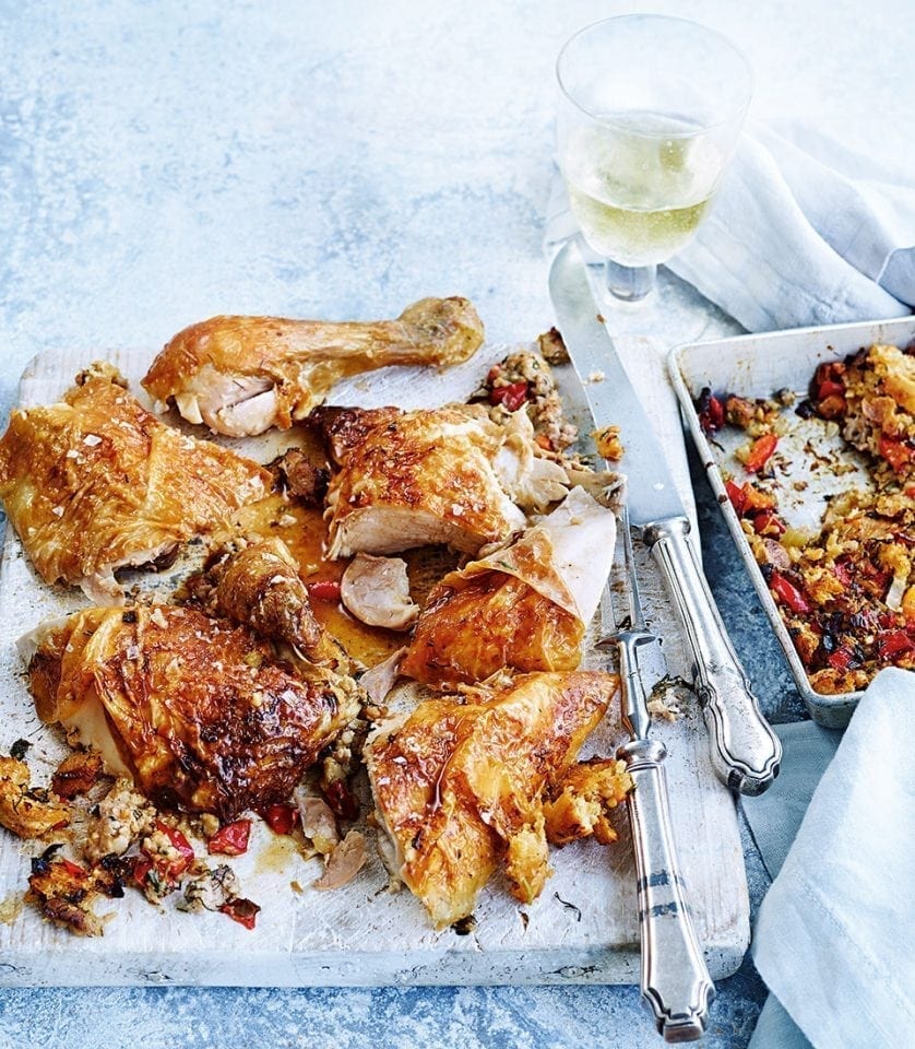 Roast chicken with sausage stuffing recipe | delicious. magazine