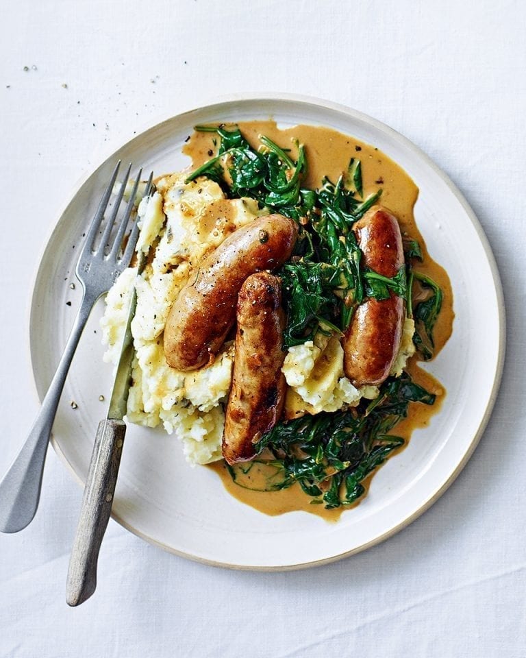 Sausages with creamy spinach sauce and garlic and caper mash