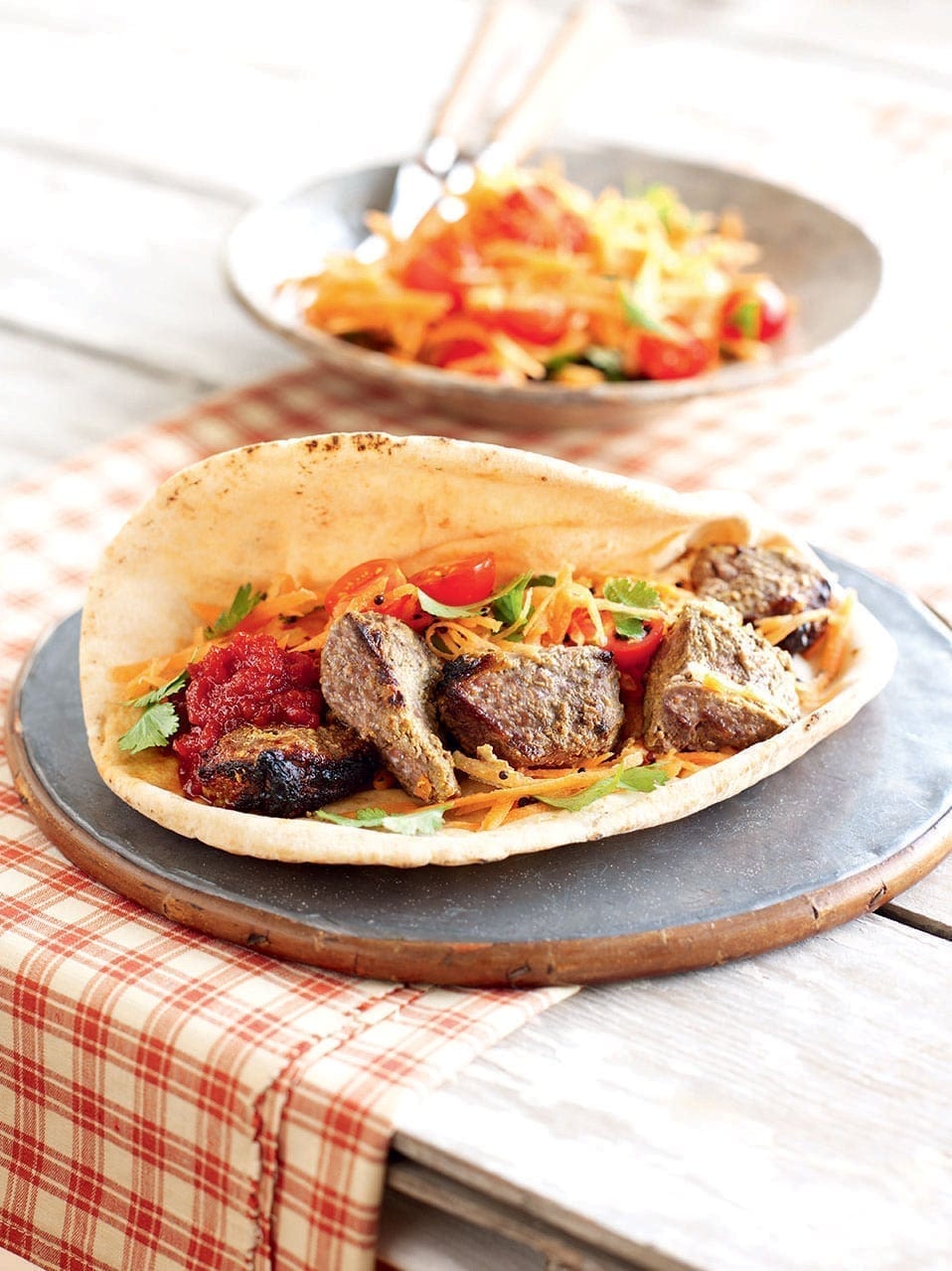 Lamb tikka with spiced carrot salad in flatbread recipe | delicious ...