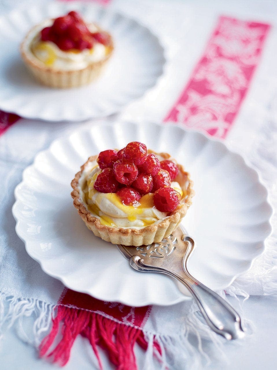 Glazed raspberry and white chocolate tarts recipe | delicious. magazine