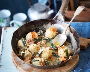 Gnudi with fried sage, hazelnuts and jerusalem artichoke crisps