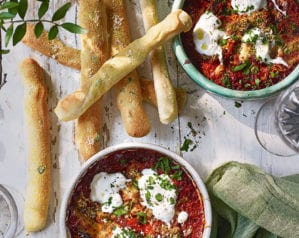 Baked 'nduja, orange and burrata dip with olive breadsticks