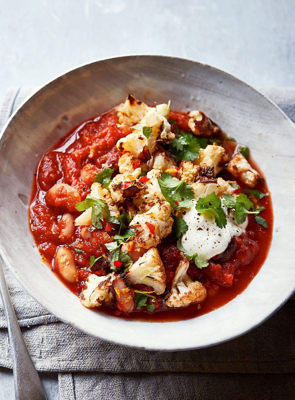 spicy-bean-stew-with-crispy-cauli-topping-delicious-magazine