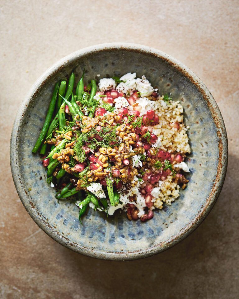 Green beans, bulgur, feta and pomegranate with sunflower seed dressing