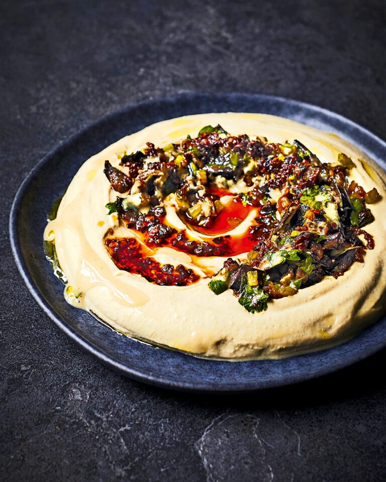 Houmous with caramelised aubergine, pomegranate and chilli crisp