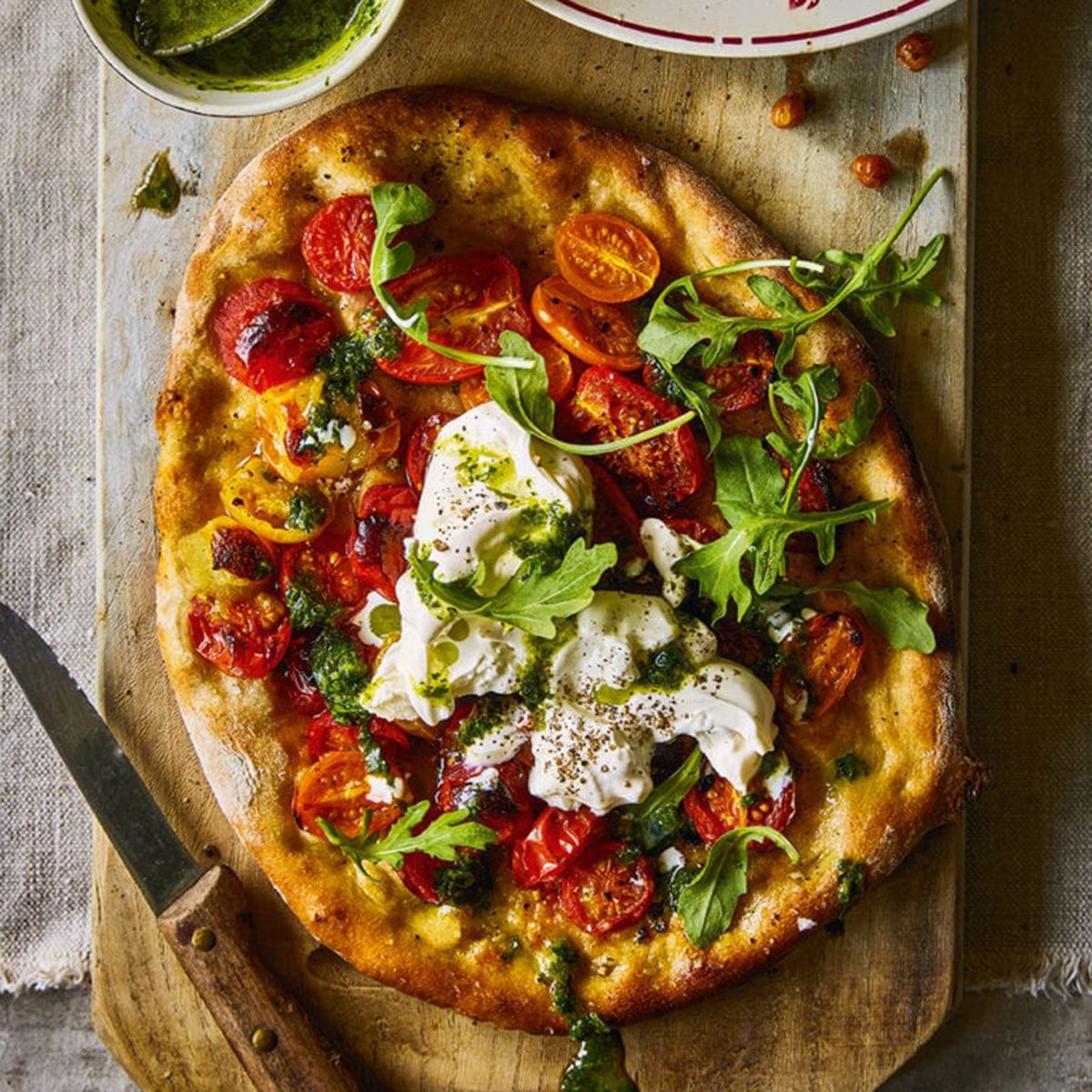 Cherry tomato, burrata and herb pesto pizzas